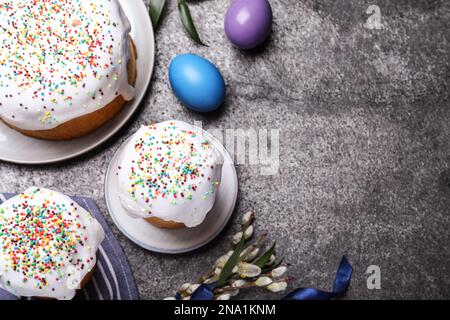 Flat lay composition with traditional Easter cakes on grey table. Space for text Stock Photo