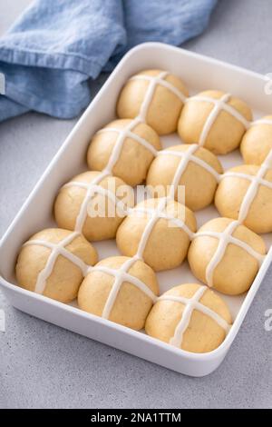 Hot cross buns for Easter in a baking dish ready to be baked Stock Photo