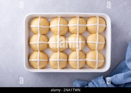 Hot cross buns for Easter in a baking dish ready to be baked Stock Photo