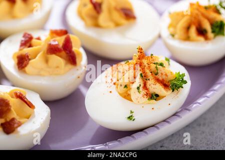 Deviled eggs with bacon and smoked paprika for Easter brunch Stock Photo