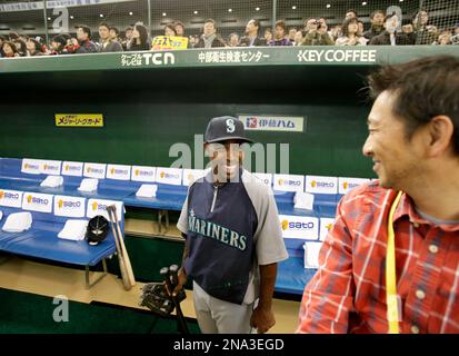 Former major league MVP player Jose Canseco wearing a Yokohama BayStars  uniform waves to spectators before the start of a Japanese professional  baseball game between the BayStars and the Rakuten Eagles at