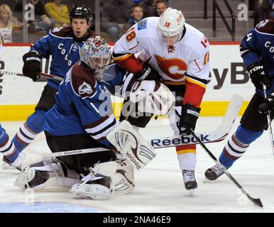 Calgary Flames starting goalie Miikka Kiprusoff (R) of Finland skates off  the ice after being replaced against the Colorado Avalanche during the  third period at the Pepsi Center in Denver on March