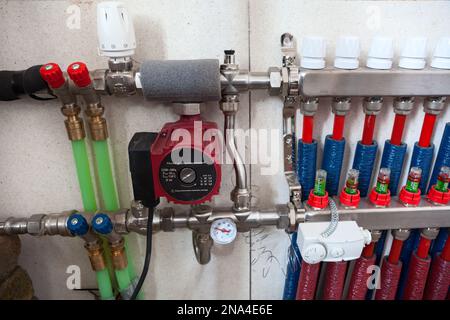 Mixing pump for underfloor heating manifold in supply line Stock Photo