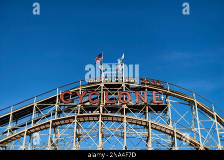 People riding the Cyclone roller coaster in Luna Park; Coney Island, New York, United States of America Stock Photo