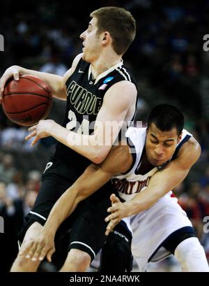 Purdue guard Ryne Smith (24) congratulates teammate Lewis Jackson, right,  during the second half against St. Peter's in the second round of the 2011  NCAA Men's Basketball Championship at the United Center