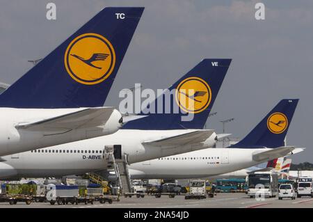 FILE - This July 28, 2008 file picture shows Lufthansa planes at Frankfurt's Rhein-Main airport. Lufthansa AG says Thursday, March 15, 2012, it expects lower profits this year as high fuel prices and economic uncertainties weigh on earnings. The company said its operating profit is expected to slide from euro 820 million (US dollar1.1 billion) in 2011 to a 'mid three-figure million euro range' in 2012. (AP Photo/Daniel Roland, File)