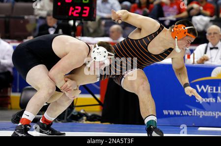 Milton s Ryan Solomon left grabs the leg of Hanover s Derek