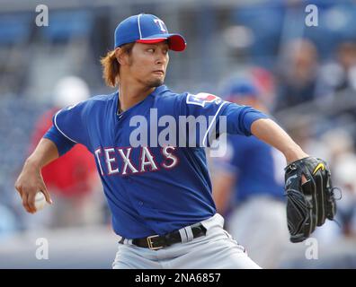 Yu Darvish (Rangers), MARCH 11, 2012 - MLB : Yu Darvish of the Texas  Rangers holds his teammate's son in his arms during the Texas Rangers  spring training camp in Surprise, Arizona