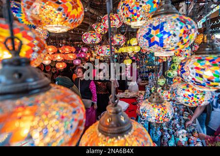 Faridabad, India. 12th Feb, 2023. Visitors look at traditional bright decorative hanging Turkish colorful lights at Turkey stall during the 36th Surajkund International Crafts Fair at Faridabad. The Surajkund Mela (fair) is one of the most famous and celebrated melas (Fairs) in India. It is organized every year in Faridabad during the first half of the month of February. This is one of the most celebrated International Crafts mela (fair) and is organized by the Haryana state Tourism Department. (Photo by Pradeep Gaur/SOPA Images/Sipa USA) Credit: Sipa USA/Alamy Live News Stock Photo