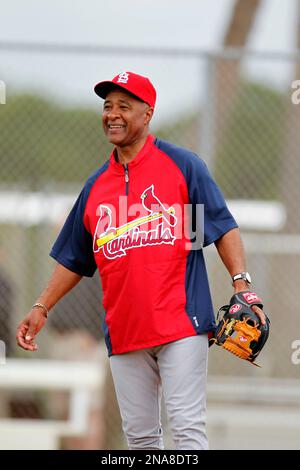 Former St. Louis Cardinals shortstop and National Baseball Hall of Fame  member Ozzie Smith (R) says hello to pitchers Jake Westbrook and Joe Kelly  after pre game ceremonies at Busch Stadium in