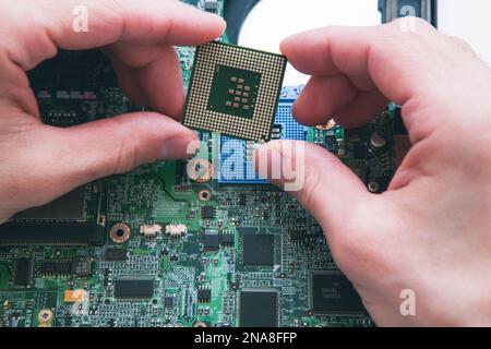 Analysis , installing of processor in CPU socket Stock Photo