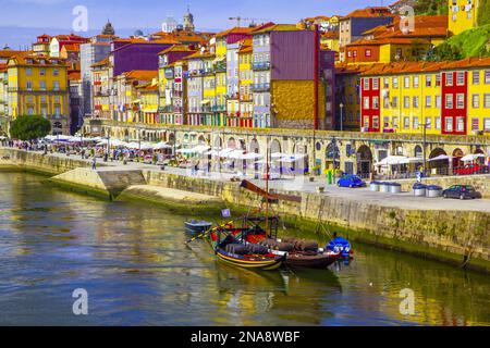 Colourful buildings along the river in Porto; Porto, Ribeira District, Portugal Stock Photo