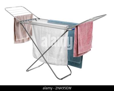 Modern drying rack with towels on white background Stock Photo