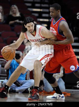 Houston Rockets forward Luis Scola, of Argentina, sports some ANTA shoes as  he takes a break from warming up prior to the Golden State Warriors vs.  Houston Rockets game at Toyota Center