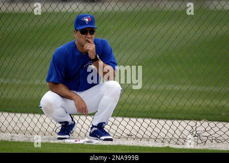 Toronto Blue Jays manager John Schneider (L) and bench coach Don Mattingly  walk to the dugout