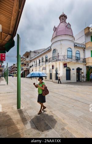 Pedestrians in Place de la Victoire in Pointe-a-Pitre, Grande-Terre, Guadeloupe, French West Indies; Pointe-a-Pitre, Grande-Terre, Guadeloupe, France Stock Photo