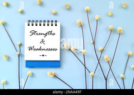 Personal strengths and weaknesses written on blue notepad. Personality development and self awareness concept. Stock Photo