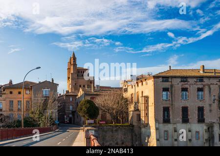 Rabastens and its iconic church, Notre-Dame-du-Bourg, seen from the bridge over the Tarn, in Tarn, Occitanie, France Stock Photo