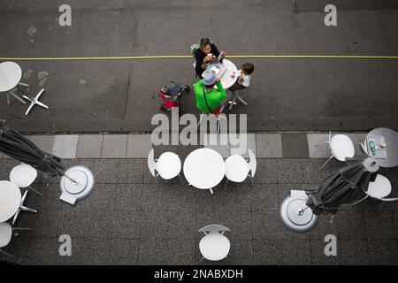 At the Parc de la Villette, an aerial view of a family eating a meal in Paris, France; Paris, France Stock Photo