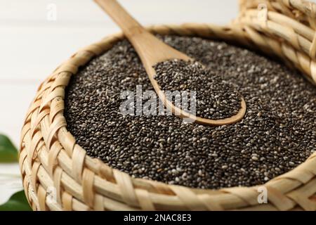 Wicker box with chia seeds and spoon, closeup Stock Photo