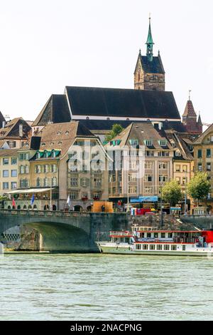 Colorful waterfront or Schifflände by Rhine River in Basel, Switzerland. In the heart of Basel by the Schifflände, Rhine River in Basel, Switzerland. Stock Photo