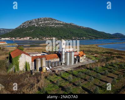 Aerial drone view of the salt pan in the city of Ston in Croatia. Salt fields. Ston Salt Works. Tourism near the Adriatic sea. Stock Photo