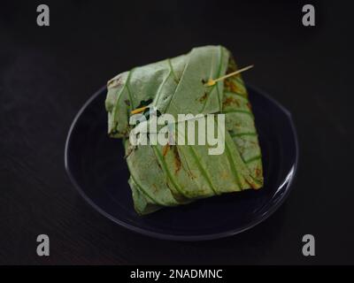 Rice Wrapped in Lotus Leaves . Thai food . Stock Photo