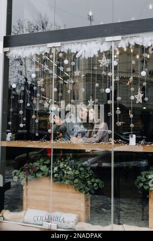 couple of lovers on a date in a winter cafe on holidays Stock Photo