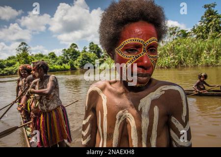 Women in boats living along the Karawari River in the Sepik area of Papua New Guinea. Stock Photo