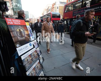 Jehovah witness  The Watchtower, magazine stall outside Liverpool Street  London Railway Station  in The City of London Stock Photo