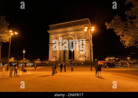 Arc de Triomphe lit up at night in Paris Stock Photo