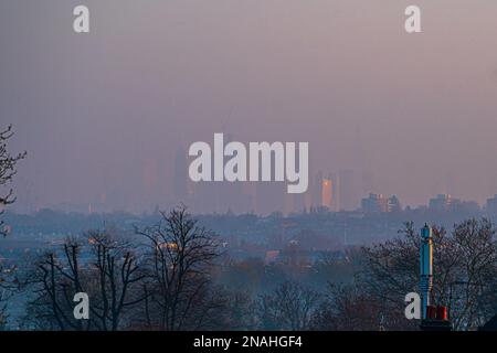 London, UK. 13 February 2023. The skyscrapers of the City of London financial district are shrouded in hazy sunshine at dawn . The forecast is for mild weather this week before  temperatures  drop reaching as low as minus 11C at the end of February as the ‘Beast from the East’ returns. Credit: amer ghazzal/Alamy Live News Stock Photo