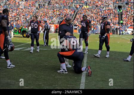 Denver Broncos players react during the NFL football game between