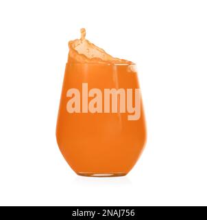 Juice splashing out of glass on white background Stock Photo