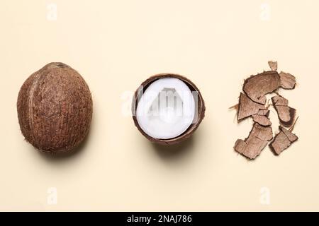 Flat lay composition with coconuts on beige background Stock Photo