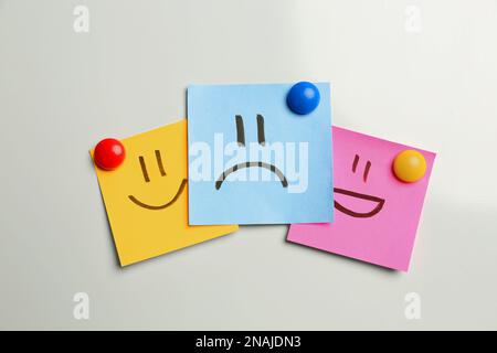 Stickers with sad and happy faces on white background, flat lay Stock Photo