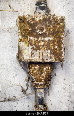 Old electrical installations Cast iron house junction box Stock Photo