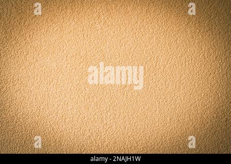 Abstract vignetting brown beige plastered wall background. Stock Photo