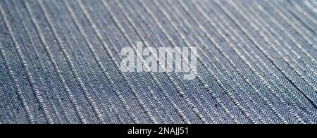 Cotton textile blue material close-up abstract defocused background. Stock Photo