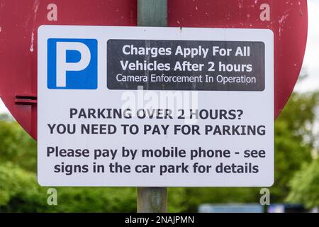 Car parking charges notification after two hours of free car parking in a public car park. Stock Photo