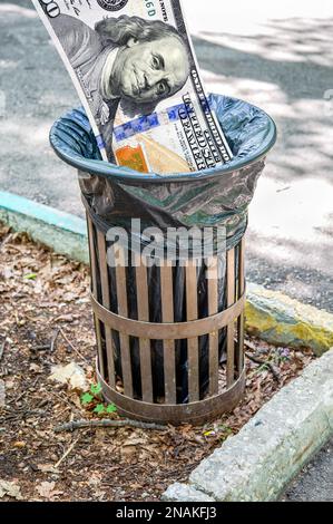 Dollars banknote in the garbage bin. Trash can with american money ...