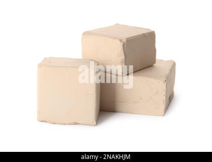 Blocks of compressed yeast on white background Stock Photo