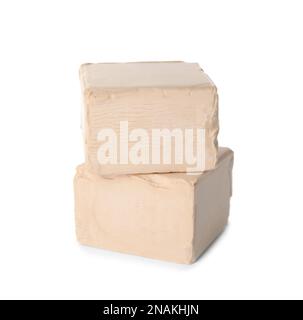 Blocks of compressed yeast on white background Stock Photo