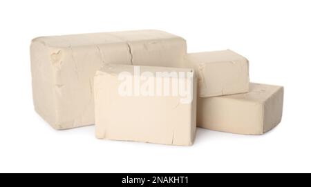 Blocks of compressed yeast on white background Stock Photo