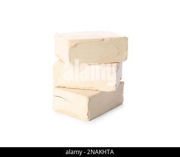 Blocks of compressed yeast on white background Stock Photo