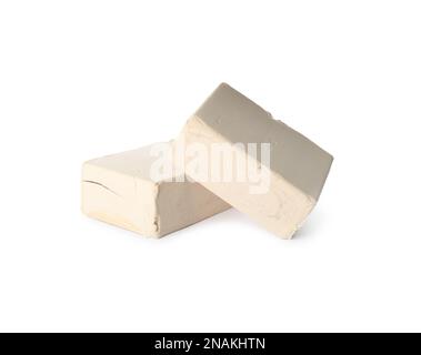 Blocks of compressed yeast on white background Stock Photo