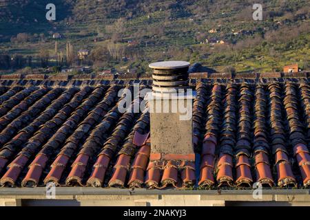 Old chimney pipe outlet on roof horizontally Stock Photo