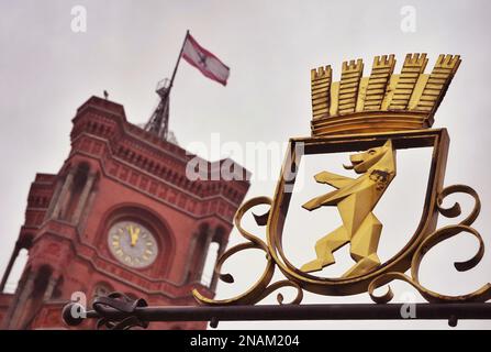 13 February 2023, Berlin: The gilded city coat of arms of Berlin with the bear and a crown can be seen in front of the Red City Hall after the repeat election to the Berlin House of Representatives. Photo: Soeren Stache/dpa Stock Photo