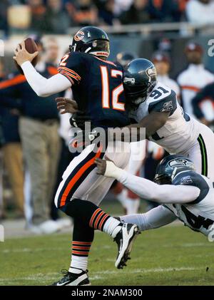 Seattle Seahawks defensive end Anthony Hargrove (94) celebrates after  sacking Chicago Bears quarterback Caleb Hanie in the first half of an NFL  football game in Chicago, Sunday, Dec. 18, 2011. (AP Photo/Charles