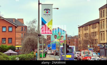 Traffic on Maryhill road district banner with multicultural mural in the background Stock Photo